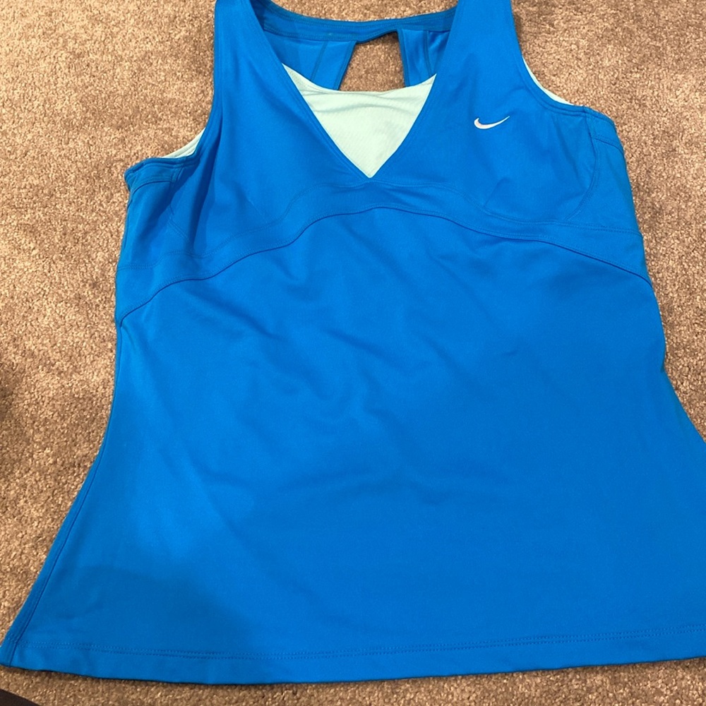 Ladies blue active wear top with built-in bra for working out, or playing tennis